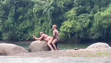 Fucking in the river in the rain with a hot bear and another hottie