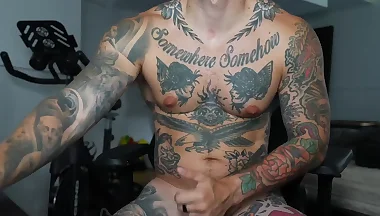 Heavily Tattooed Guy Cums on His Thigh