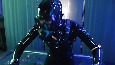 Rubberboy with gas mask pisses and cums